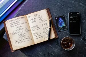 Editorial tech flatlay of open leather journal with companion prompt formulas, fountain pen and glowing NFC card
